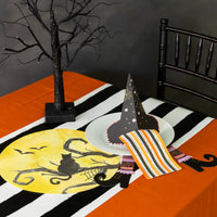 Single black witch’s hat cardstock napkin holder on white background showing slit for napkin.