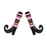 Single pair of paper witch’s legs with striped socks and buckled shoes on a white background.