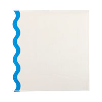 Single white cocktail napkin folded with bold blue scallop border.