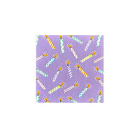 Lilac cocktail napkin covered in multicolor striped birthday candles, perfect accent for versatile birthday party ideas
