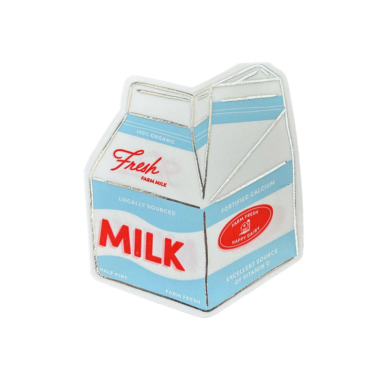 Single die-cut milk-carton napkin on white background showing retro blue label, red “MILK” text, and silver foil accents