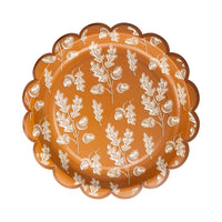 Rust scalloped plate with white acorn and oak leaf pattern