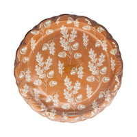 Rust scalloped plate with white acorn and oak leaf pattern