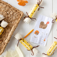 Open corn cracker with tissue crown, mini die, and game card