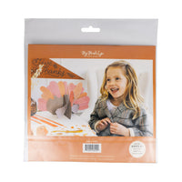 Package back showing child with finished DIY turkey centerpiece
