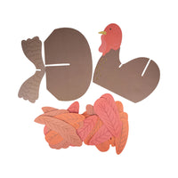Kit contents laid out, chipboard turkey parts and paper feathers