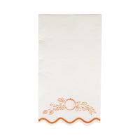 Single white guest napkin with orange pumpkin border and wavy edge