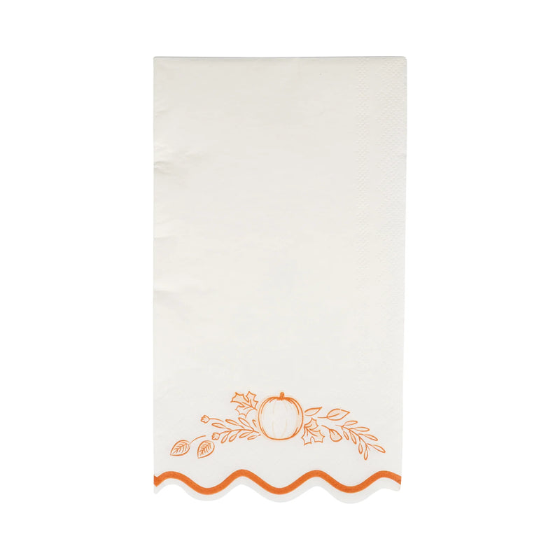 Single white guest napkin with orange pumpkin border and wavy edge