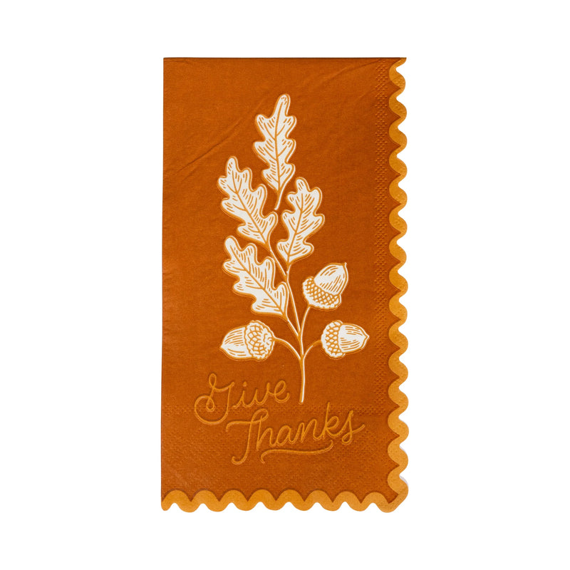 Single rust dinner napkin with acorn and oak leaf motif and scalloped border