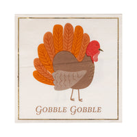 Close up of turkey napkins with gold foil details and border