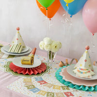 Birthday table with balloons using blush pink placemats, great for a girl baby shower