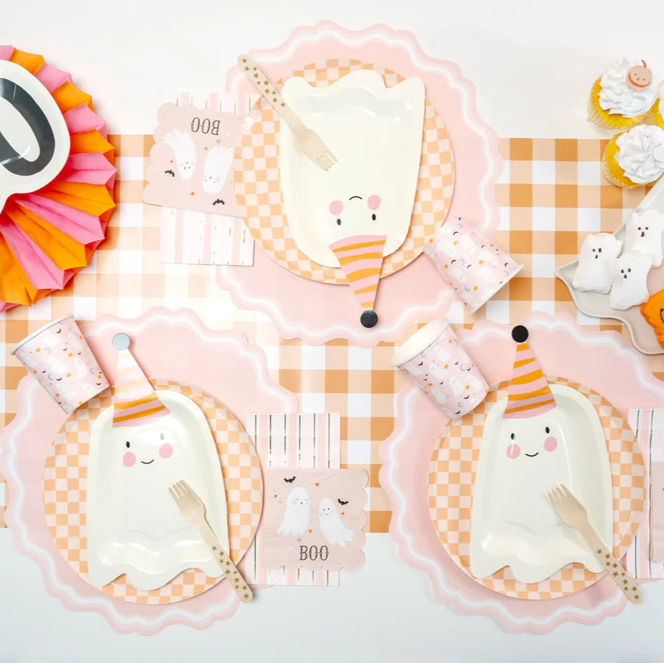 Cute party setup using blush pink placemats for a soft, kid friendly vibe