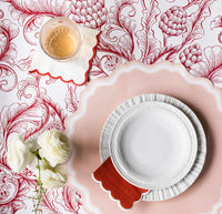 Red toile table styled with blush pink placemats under white dinnerware