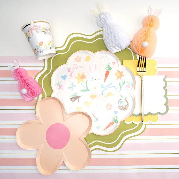 Floral plates and bunny décor styled on pink striped runner, princess party ready