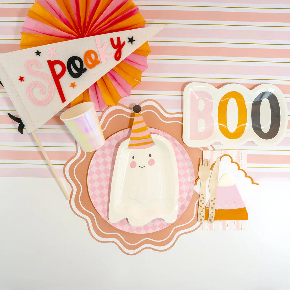 Ghost plates and BOO tray on pink striped table runner with gold lines