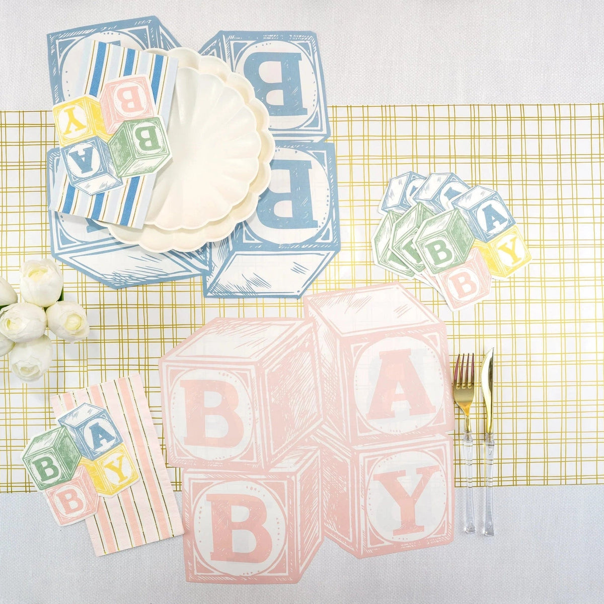 Baby shower blocks runner featuring blush striped paper guest towels