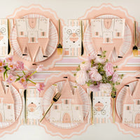 Long princess tablescape using blush striped paper guest towels