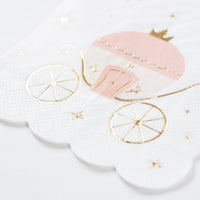 Close up of pink carriage cocktail napkin with gold foil and scalloped edge, princess napkins