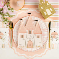 Place setting with castle plate and carriage princess napkins on pink stripe runner