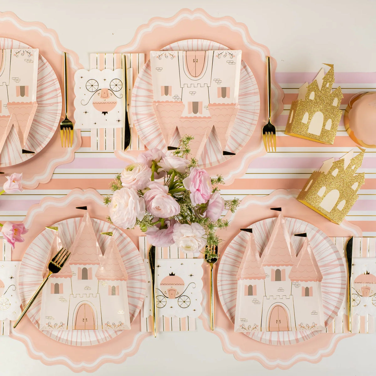 Long tablescape styled with castle plates and carriage princess napkins