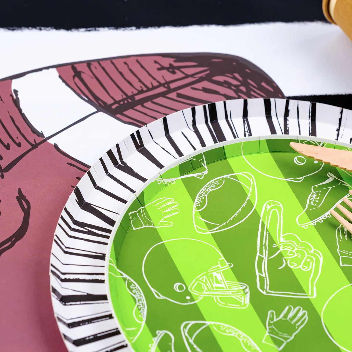 Game day setting with Radiance rim under green plate, party ready Paper Plates