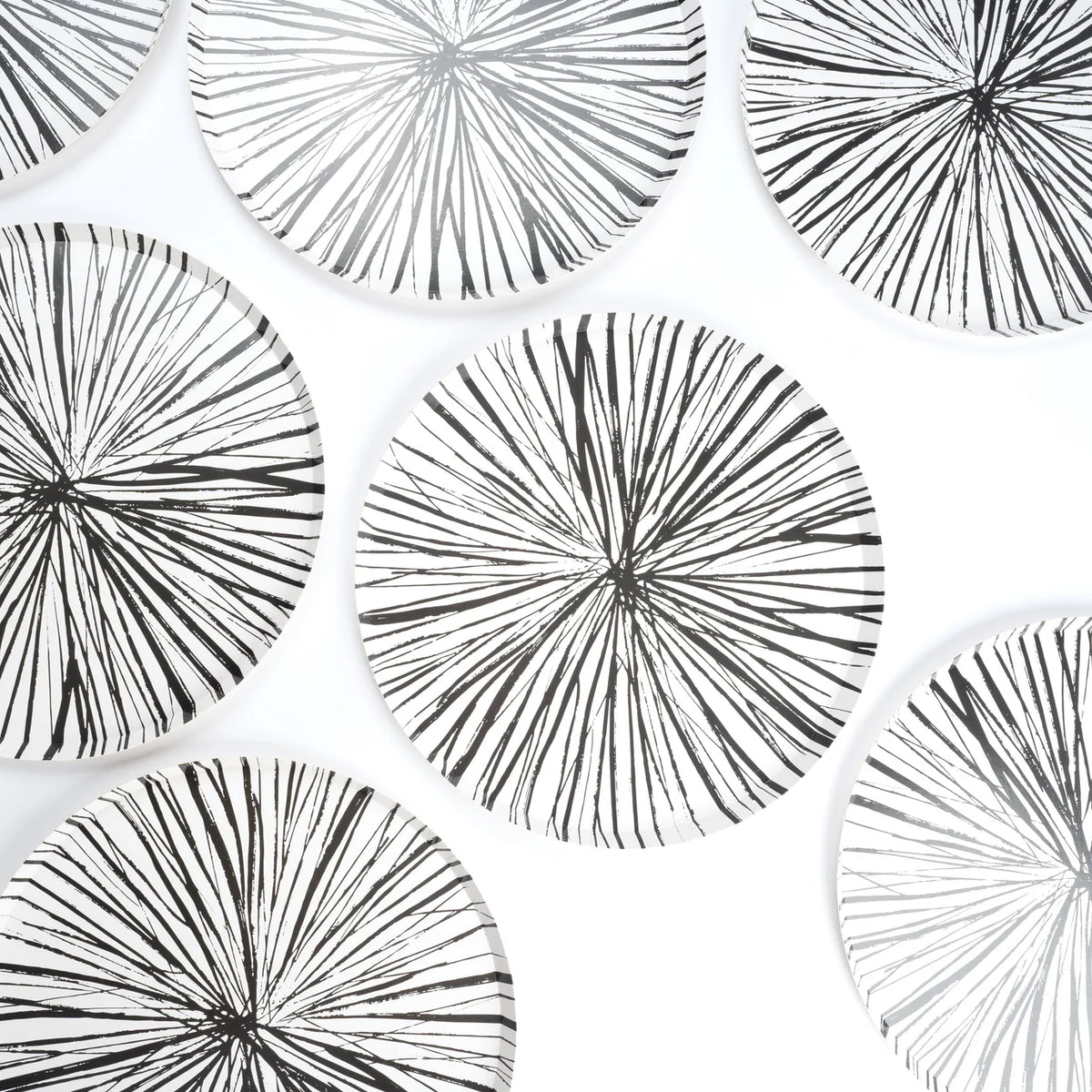 Multiple Radiance black Paper Plates arranged on white background