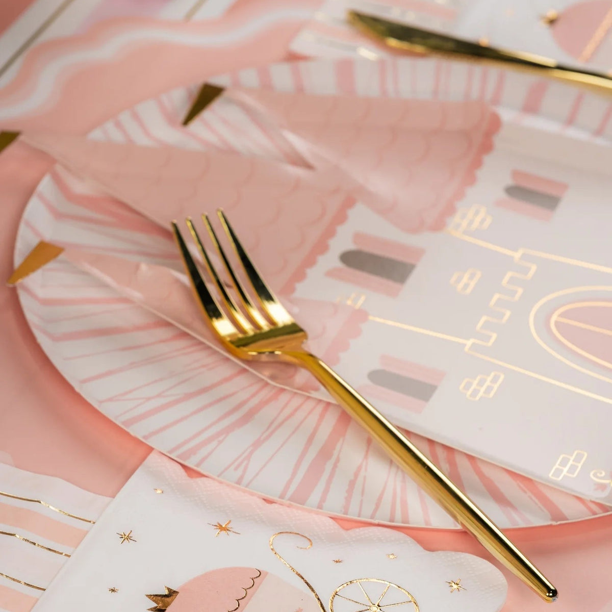 Close view of Pink Radiance plate with carriage napkin and gold fork, pretty pink party plates for showers