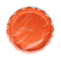 Front pack showing rust orange scalloped round dinner plates