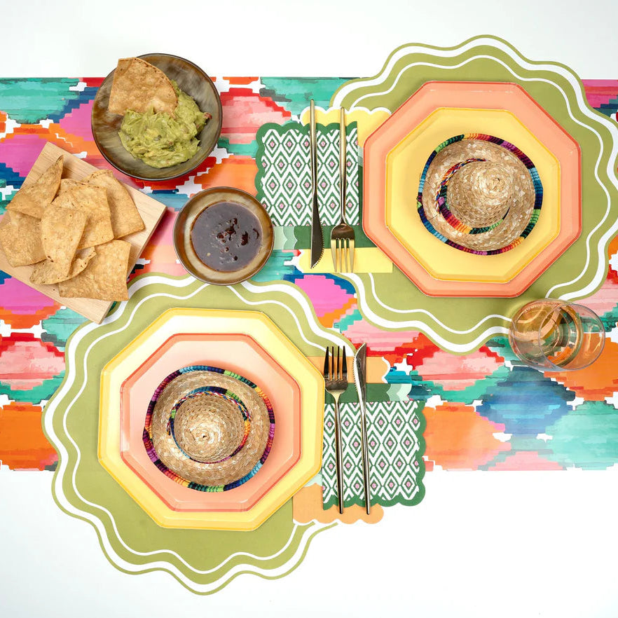 Colorful tablescape with scallop paper guest towels in fall tones