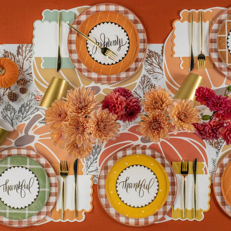 Thankful dinner table styled with scallop fall napkins at each setting