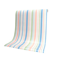 Pastel stripe paper table runner draped from roll, ready to cut to size for spring parties