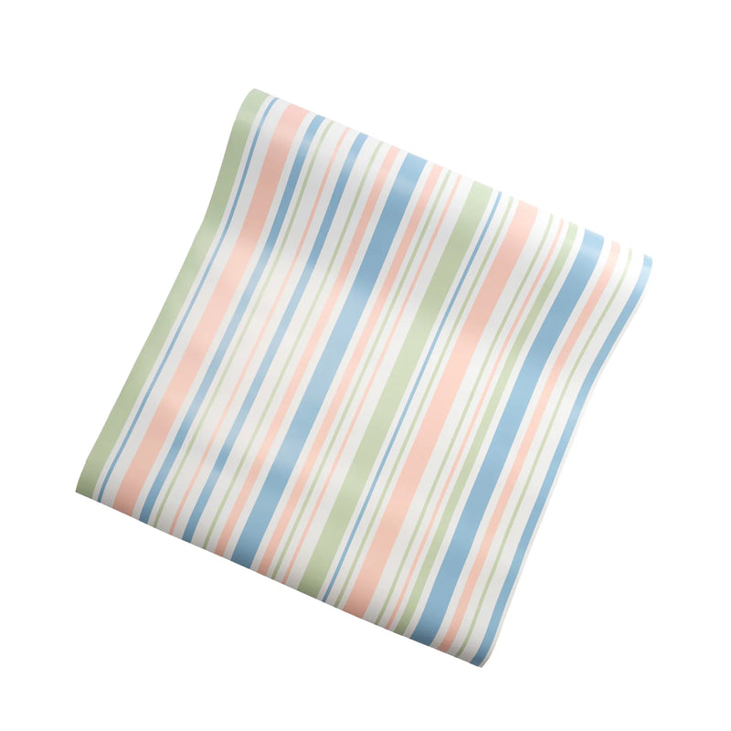 Folded spring pastel stripe paper table runner, soft pink, blue, and mint for a baby shower table