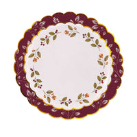 Mulberry-wreath dessert plate layered on a burgundy berry-vine scalloped charger.