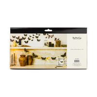 Back packaging view of My Mind's Eye Moonlight Moths and Stars paper banner showing product details and styled mantel imagery.