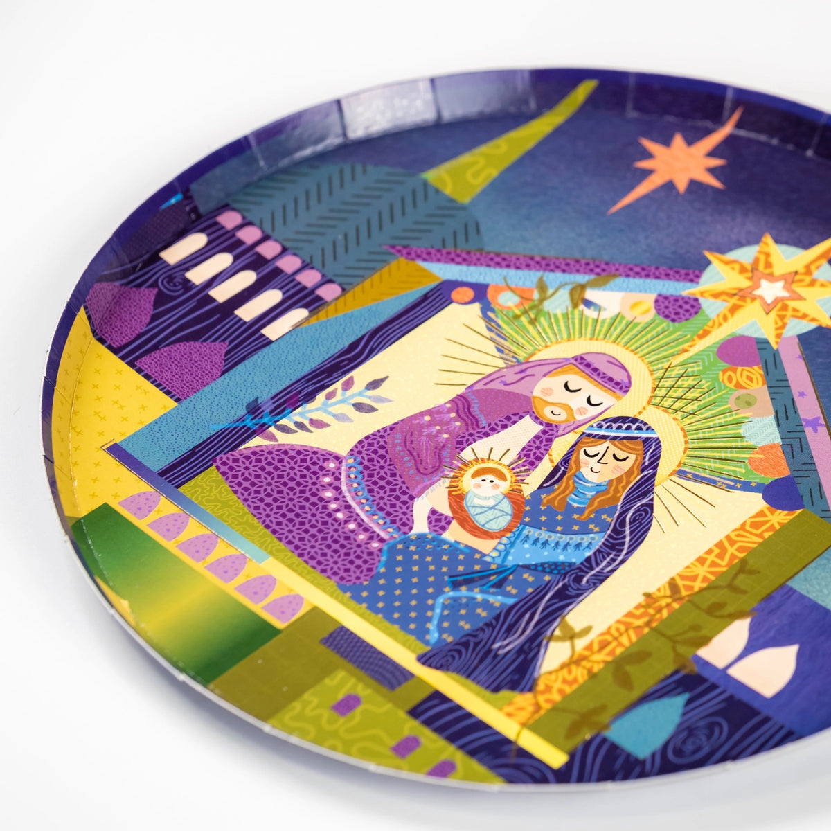 Side angle of plate showing saturated midnight blues and city shapes