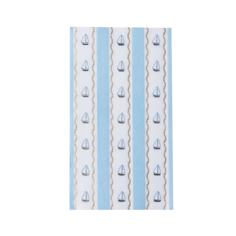 Single nautical sailboat paper guest towel laid flat showing vertical blue and white stripes, navy sailboats, and twisted gold rope lines.