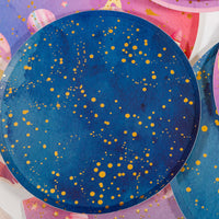 Navy gold galaxy plate styled over pink space party napkins and plates