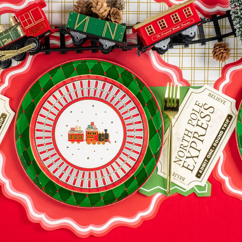 Detail of plate stack and pinecones with ticket napkin