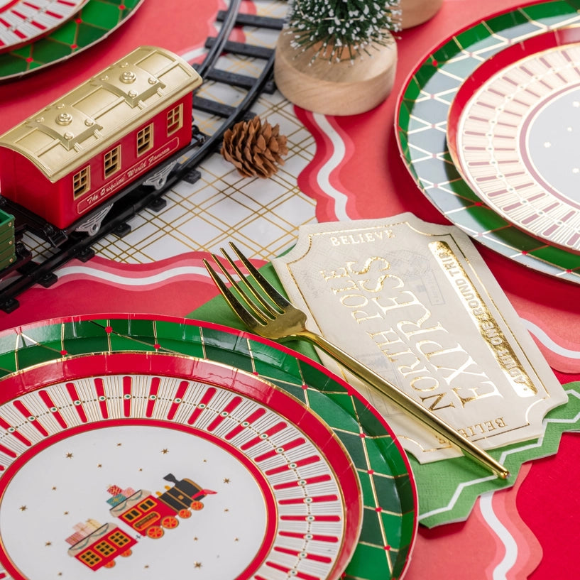 Place setting closeup with gold fork over ticket