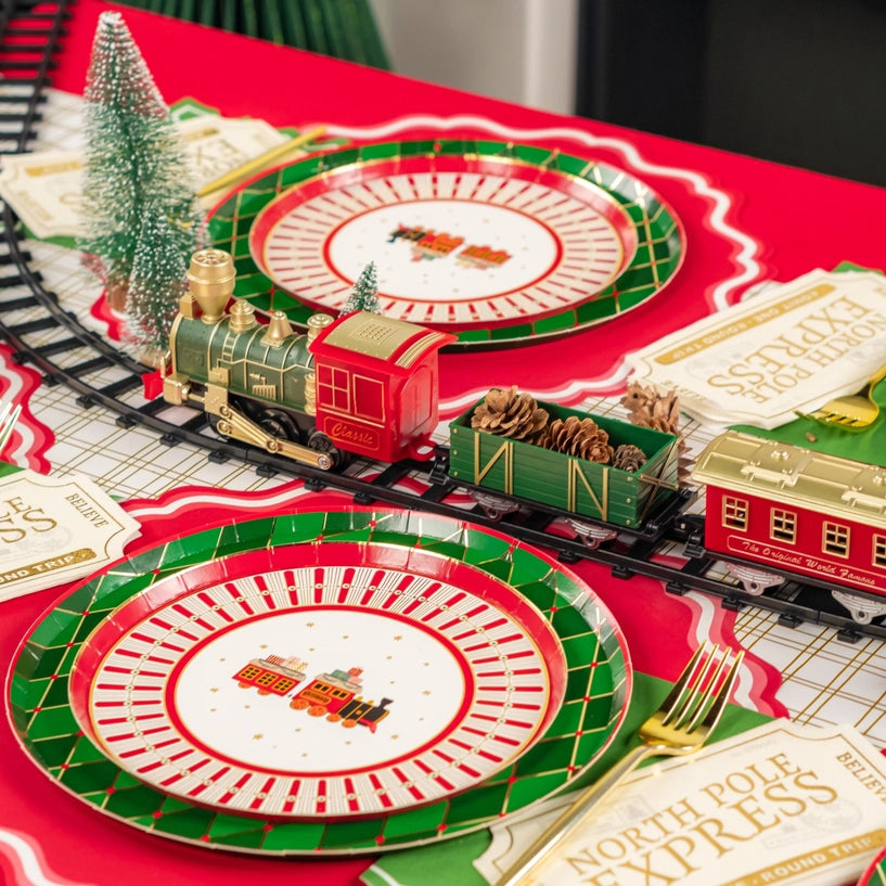 Side view of holiday train centerpiece with tickets at each setting