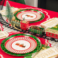 Side view of holiday train centerpiece with tickets at each setting