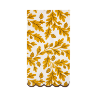Cream dinner napkin with yellow and brown oak leaves and a brown scalloped edge, front view.