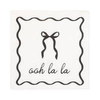 Cream cocktail napkin with black bow and “ooh la la” text.
