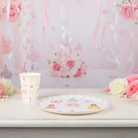 Princess plate and matching cup on a white table with pink streamers