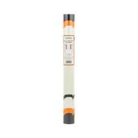 Roll of paper with a black, orange, and white design table runner.