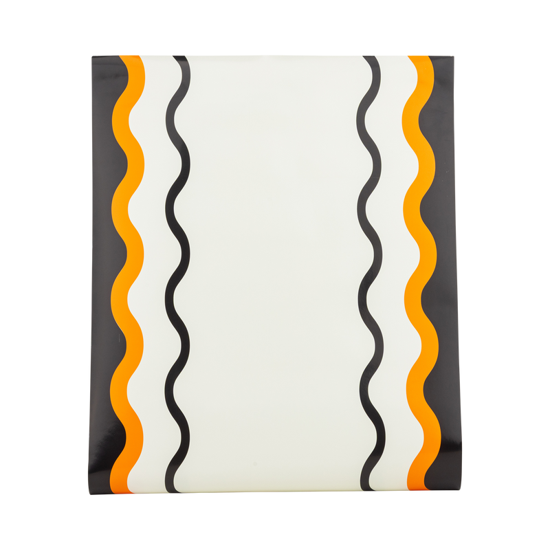 Orange, black, and cream ric-rac stripe paper table runner, shown flat to display the pattern.