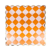 Shrink-wrapped set of eight 11-inch square Halloween paper plates featuring retro orange-and-pink checkered pattern and metallic gold scalloped rim, shown in retail packaging front view.