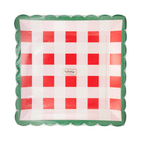 Front of the packaged set of 8 red gingham paper plates showing the plaid pattern and scalloped shape.