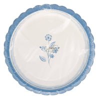 Packaged set of round blue flower Easter paper plates with scalloped edges.