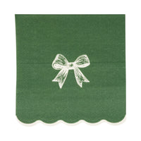 Close-up of a single dark green paper cocktail napkin featuring a white bow illustration and white scalloped edge.